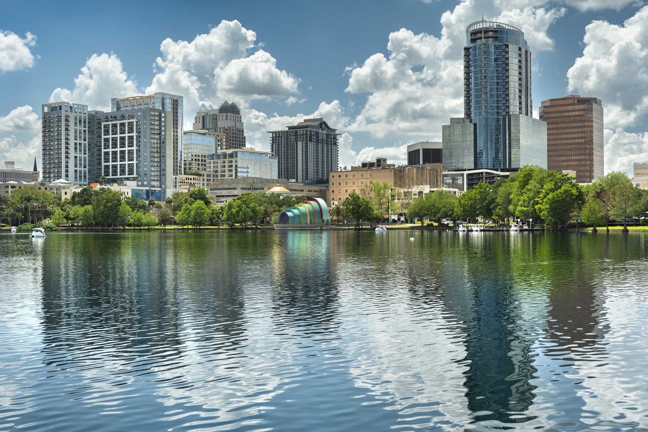 Urban downtown skyline in Lake Eola park on the water in the city center of Orlando Florida