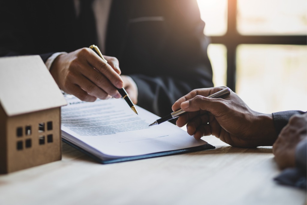 A trust attorney for Central Florida, showing a document to a client for them to sign