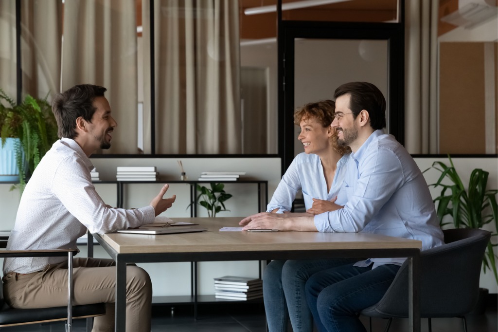 Happy couple discussing estate planning with an attorney in Central Florida