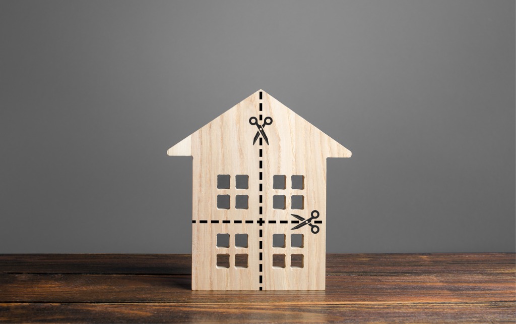 A wooden house being divided up, representative of dividing an estate after death