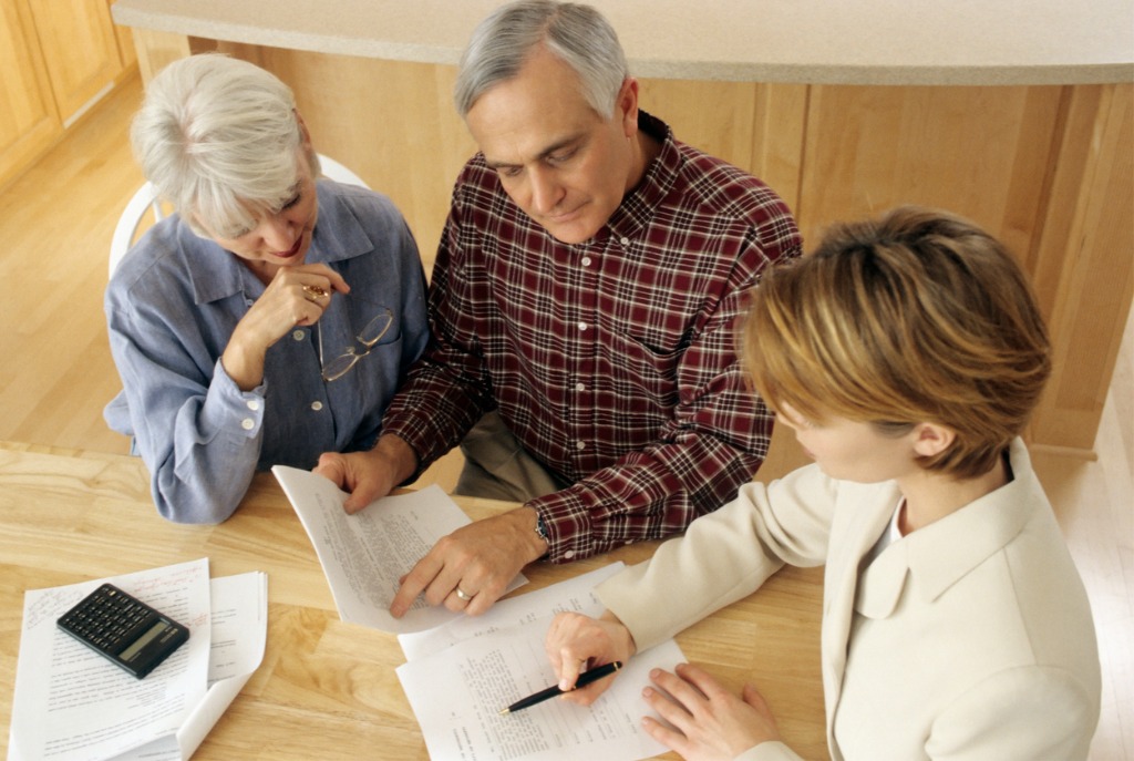 An elderly couple discussing their estate with an estate planning attorney in Central Florida
