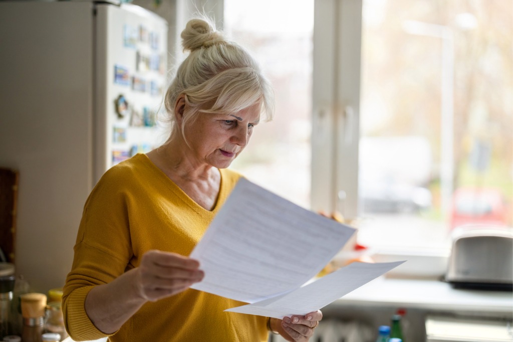 A woman looking over documents for estate planning in Florida